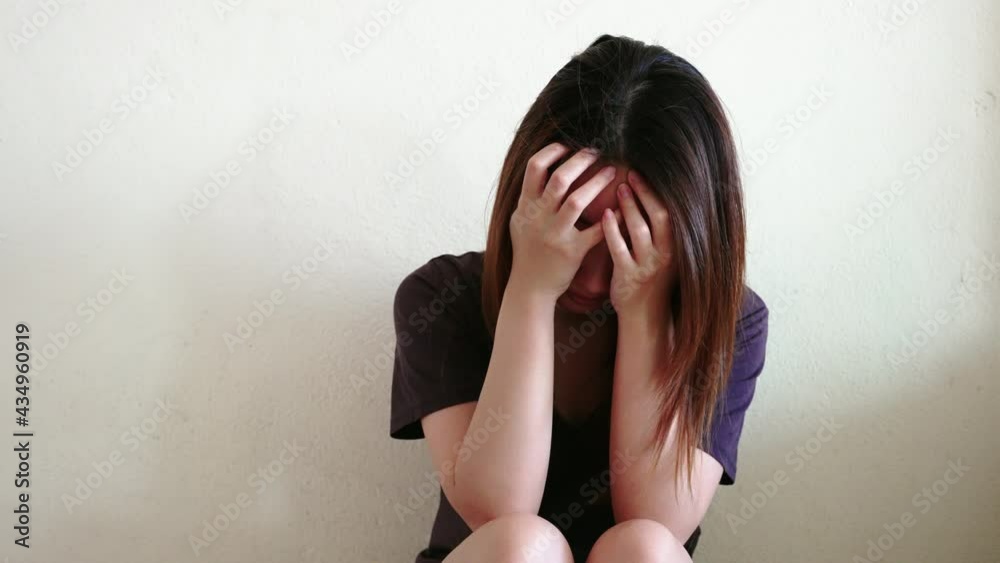 Portrait of Depressed Asian woman had a mental problem, concept of imprisonment Human trafficking and broken married and unemployment Portrait of Depressed Asian woman had a mental problem, concept of imprisonment Human trafficking and broken married and unemployment