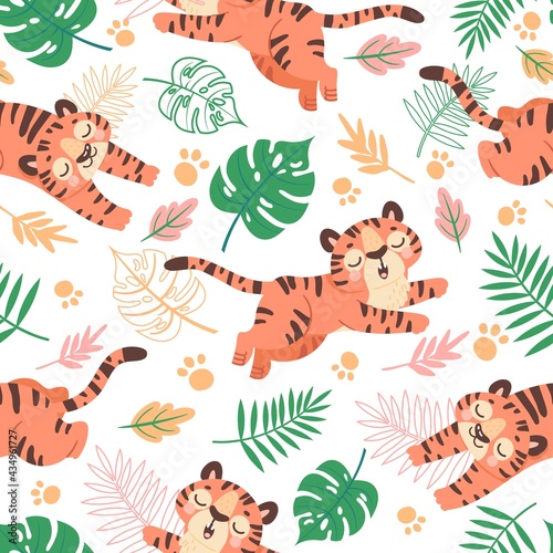 Fototapeta Naklejka Na Ścianę i Meble -  Baby tiger seamless pattern. Cute childish cartoon tigers, paw prints and tropical leaves. Jungle animal, wild cats, kids vector wallpaper