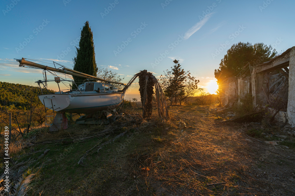 Fototapeta premium An old sailboat among trees