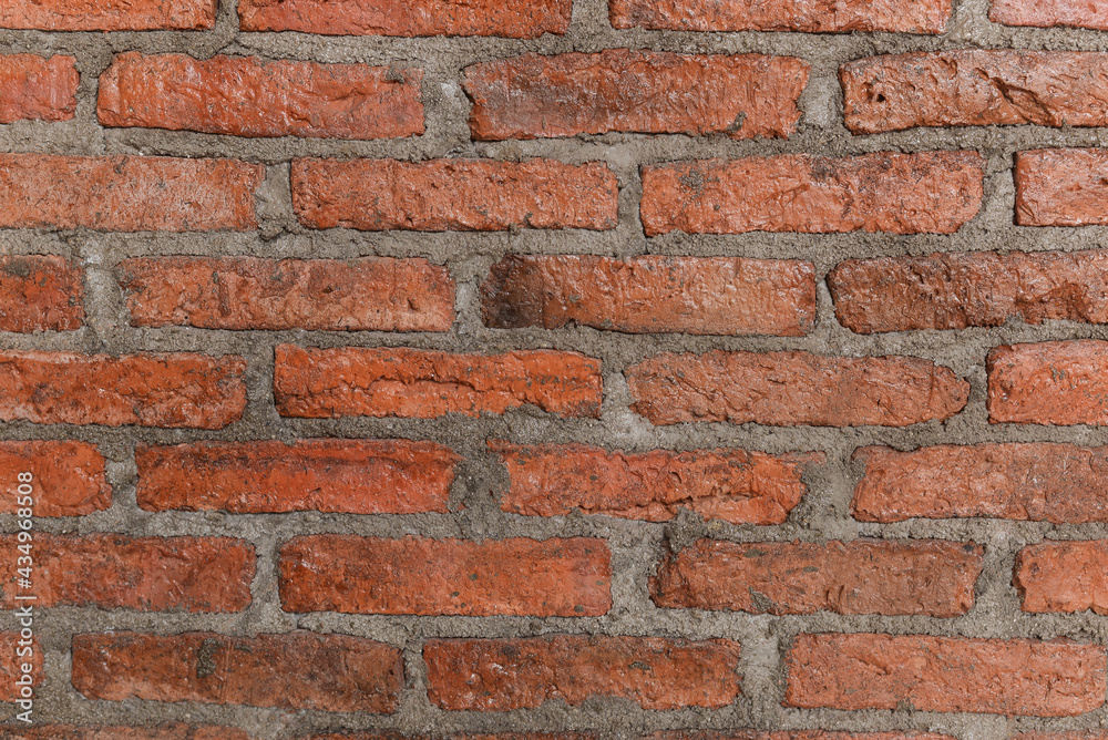 Close up old wall background with stained aged bricks Close up old wall background with stained aged bricks