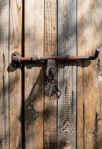 Old door lock on the barn door