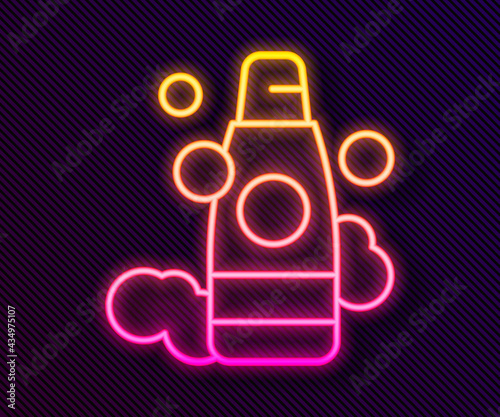 Glowing neon line Bottle of shampoo icon isolated on black background. Vector