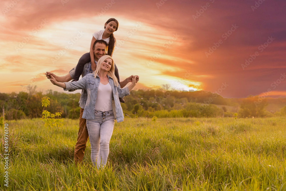 Happy family: mother, father, child daughter on nature on sunset. Happy family: mother, father, child daughter on nature on sunset.