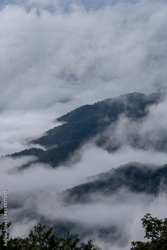 Looking Down on Thick Fog and Mountain Tops
