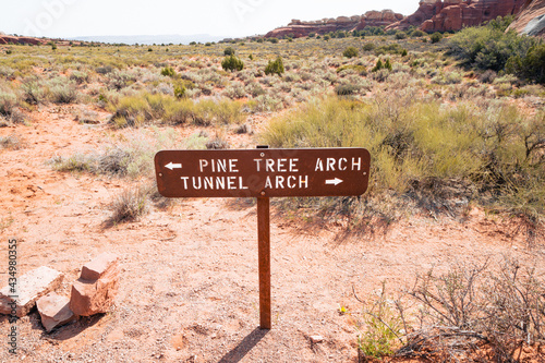 Trail direction sign for Pine Tree Arch and Tunnel Arch, part of the Devils Garden hiking trail in Arches National Park Utah