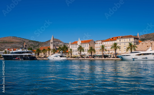 Trogir  Croatia. Sunny promenade along the pier of old Venetian town  Dalmatian Coast in Croatia. September 2020