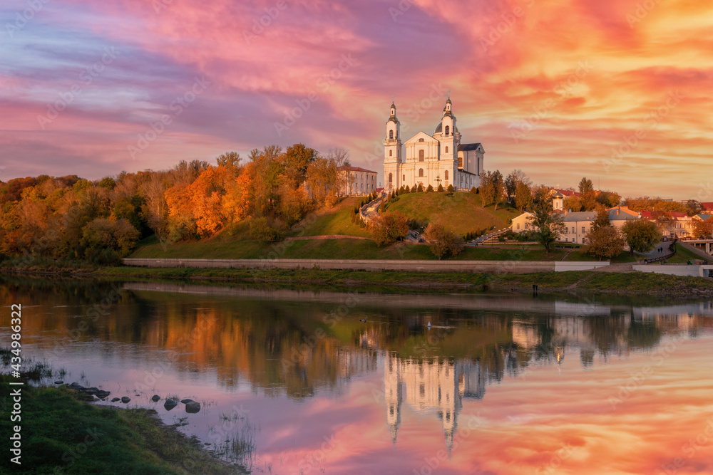 The city of Vitebsk and the Dvina river at sunset on an autumn evening. View of the assumption Cathedral.