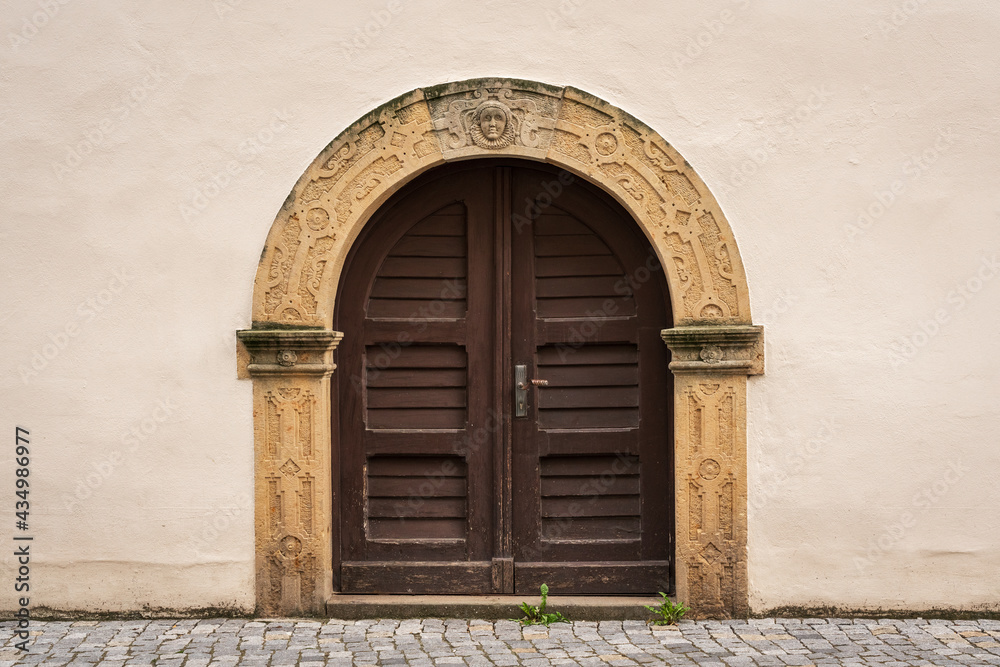 An old arched double-leaf door.