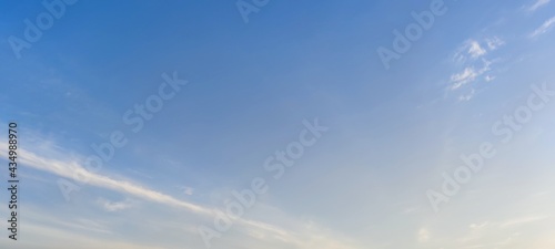White translucent clouds against the blue sky. On a clear winter day, cirrus clouds are against the background of a clear light blue sky. Clouds are almost invisible against the sky. © Andrew_Swarga