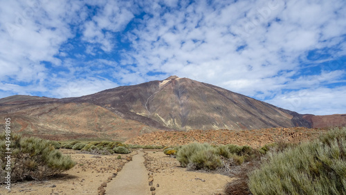 The conical volcano Mount Teide at Caldera with foot path in Tenerife, Spain highest Mountain