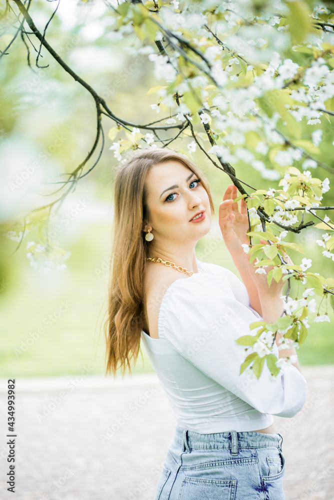 beautiful blonde girl in spring cherry garden beautiful blonde girl in spring cherry garden