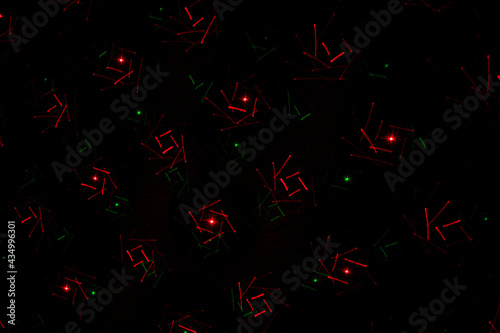 Patterns in red and green on the wall. Laser background. Party or disco concept.