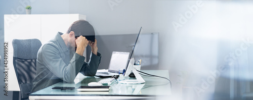 Unhappy Depressed Employee With Stress Using Computer