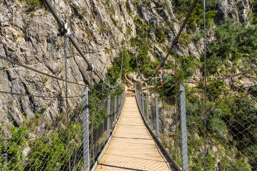 Suspension bridges in the Loriguilla reservoir. Ruta de los Pantaneros in the town of Chulilla in the Valencian community. Spain Suspension bridges in the Loriguilla reservoir. Ruta de los Pantaneros in the town of Chulilla in the Valencian community. Spain