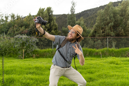 travel blogger making a video in the middle of nature 