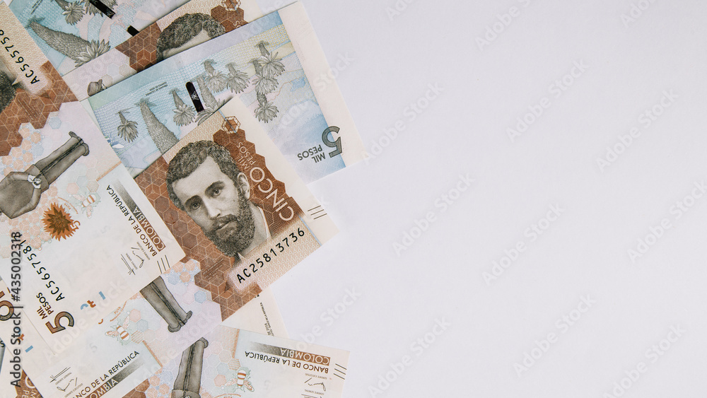 colombian money, five thousand pesos on white background