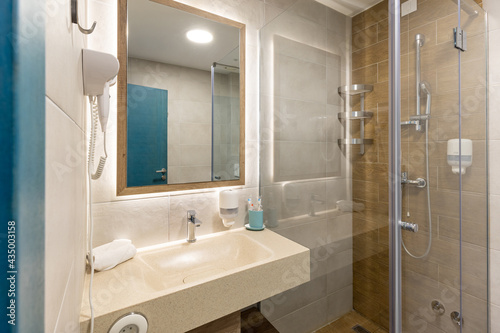 Interior of a luxury hotel bathroom with a shower cabin
