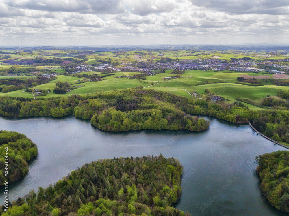 Aerial view of the Neyetalsperre (Neye Dam) in the Bergisches Land with a view of Wipperfürth in the background.