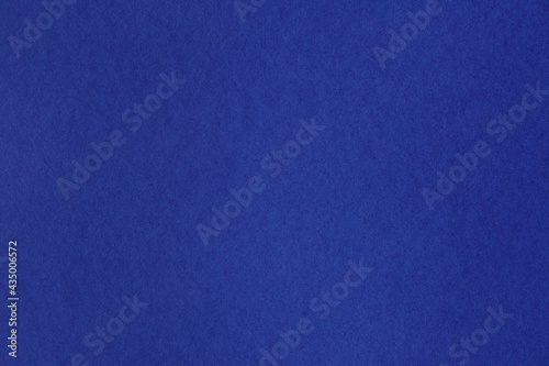 Closeup of seamless dark blue paper texture