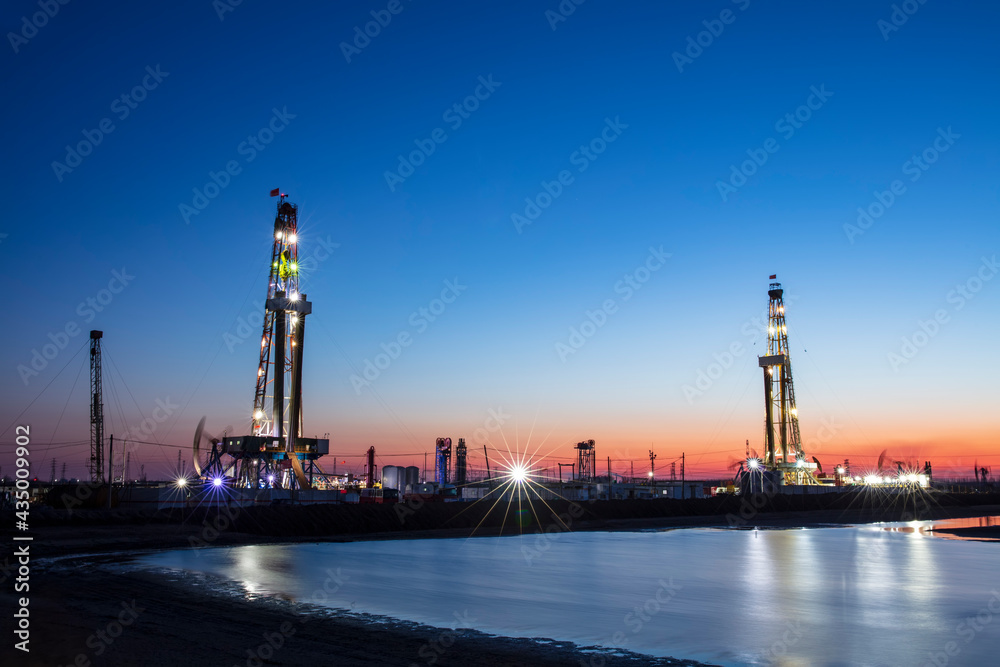 In the evening of oilfield derrick In the evening of oilfield derrick