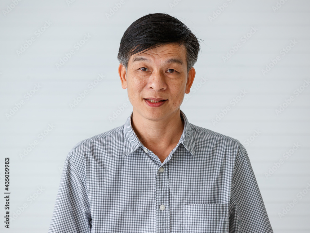 Portrait of warm personality senior older Asian man in casual dress friendly pose and looking to camera with successful feeling and self-confident Portrait of warm personality senior older Asian man in casual dress friendly pose and looking to camera with successful feeling and self-confident