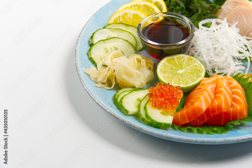 sashimi set, Japanese food. sushi restoran menu. Japanese seafood. sashimi set on plate with cucumber and salad. Takea way sashimi set. sashimi set, Japanese food. sushi restoran menu. Japanese seafood. sashimi set on plate with cucumber and salad. Takea way sashimi set.
