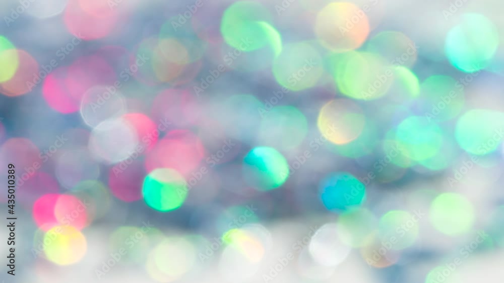 Scattering of Diamonds Creates Bokeh. Loop. A large number of small sparkling faceted crystals shimmer with all the colors of the rainbow