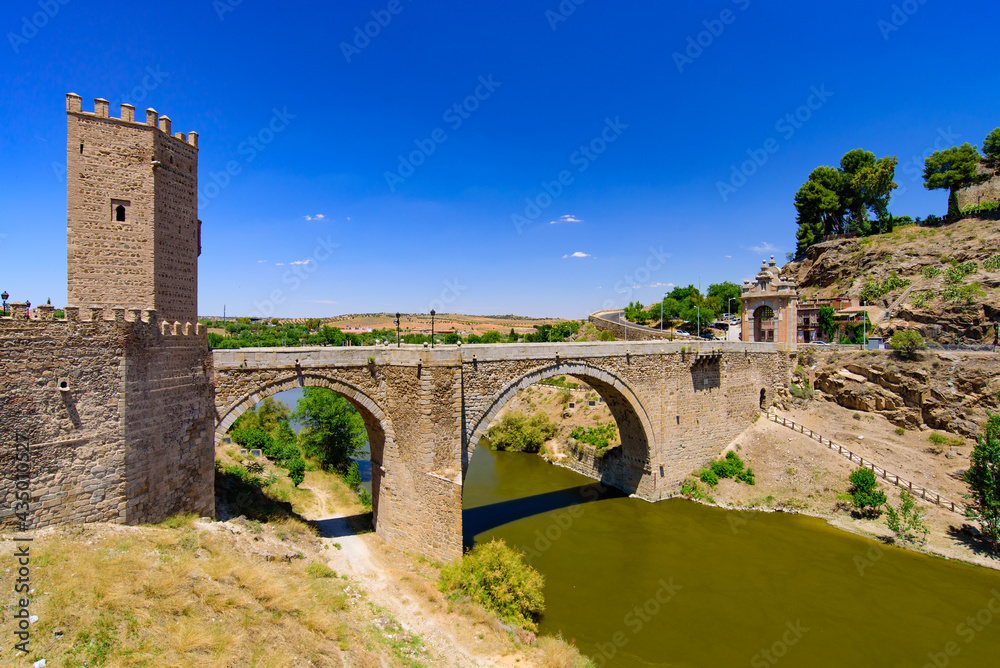 Puente de Alcántara, a Roman arch bridge across the Tagus River in Toledo, Spain