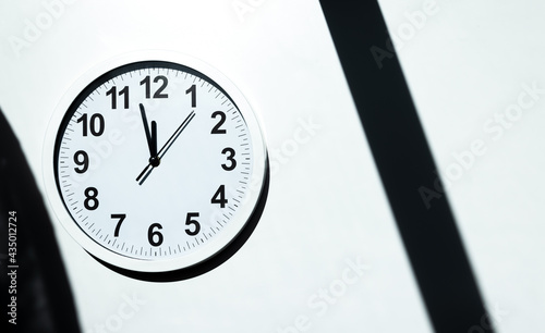 Принти на полотні White clock face of a wall clock show the time