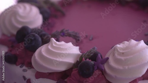 Close up of a violate blueberry cake. Newly born girls birthday treats table