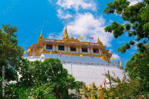 The near distance view of Wat Saket or Golden Mount is an ancient temple, a popular tourist destination in Bangkok, and a place for Buddhists to practice religious activities.