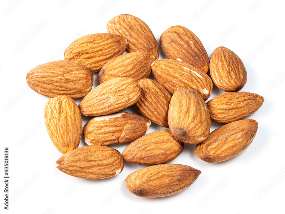 heap of almond seeds closeup on white heap of almond seeds closeup on white
