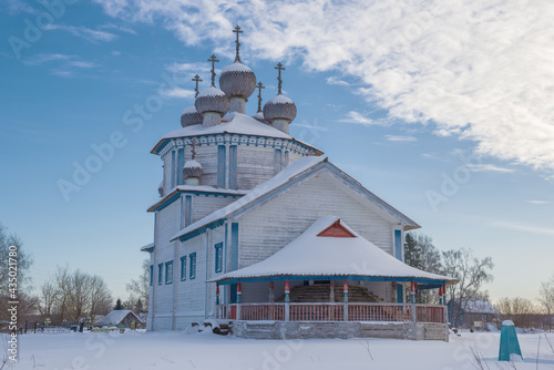 Old wooden Epiphany church close up on February morning. Stoletovskaya (Lyadiny). Arkhangelsk region, Russia