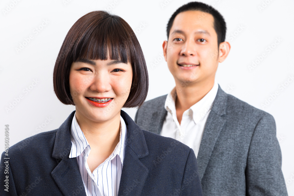 Asians executive businessman and businesswoman smile and standing on white background. Asians executive businessman and businesswoman smile and standing on white background.