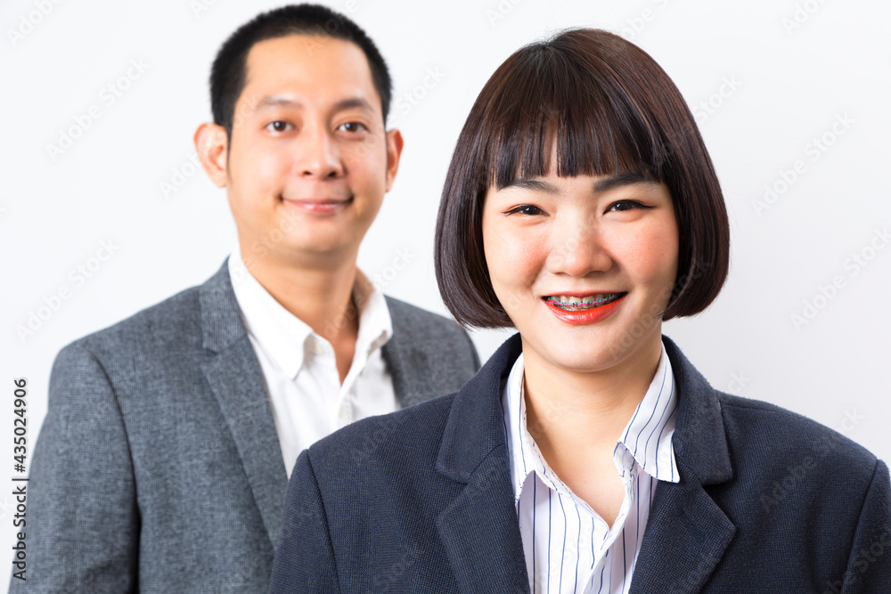 Asians executive businessman and businesswoman smile and standing on white background. Asians executive businessman and businesswoman smile and standing on white background.