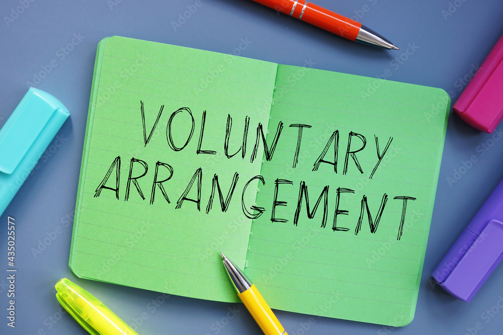 Financial concept about Voluntary Arrangement with inscription on the piece of paper. Financial concept about Voluntary Arrangement with inscription on the piece of paper.