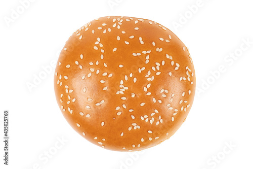 Fresh burger bun isolated on white background with clipping path.  Sesame seed hamburger bun isolated on white. Top view.