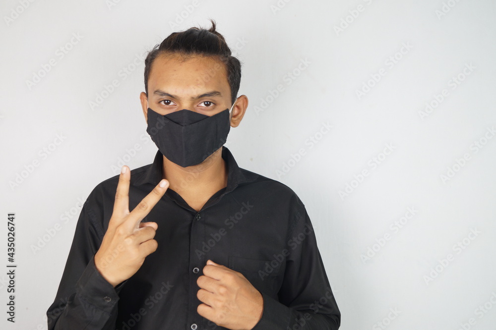 Fototapeta premium young man wearing mask , face mask , corona warriors , using sanitizer image . Vastav Kharat .