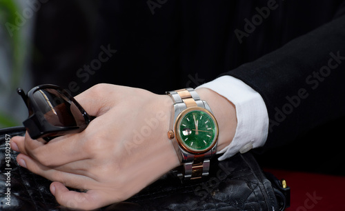 luxury watch with green dial It is a wrist watch for business people.