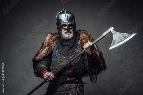 Studio shot of antique old age viking with axe