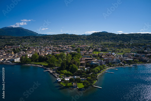 Aerial view of Bardolino, Lake Garda, Italy. Panorama of the historic town of Bardolino. Top view of the historic part of the city of Bardolino on the coastline of Lake Garda.