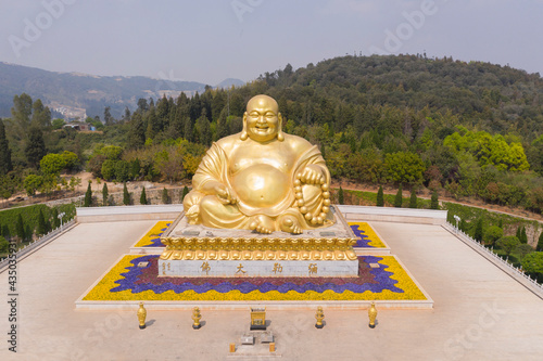 Aerial view of Giant Happy Buddha in Jinpingshan park in Mile city near Kunming, in Yunnan - China photo