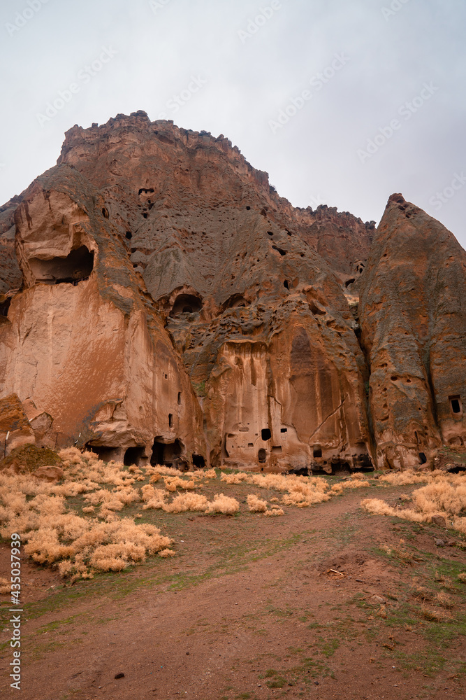 Vertical view of the ancient Selime Monastery in Cappadocia, Turkey on a moody day Vertical view of the ancient Selime Monastery in Cappadocia, Turkey on a moody day