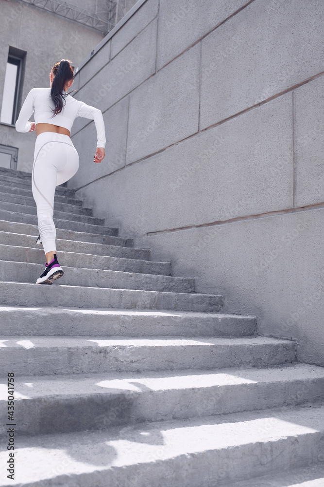 Young woman is doing sports outdoor. Young woman is doing sports outdoor.