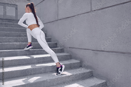 Fototapeta Naklejka Na Ścianę i Meble -  Young woman is doing sports outdoor.