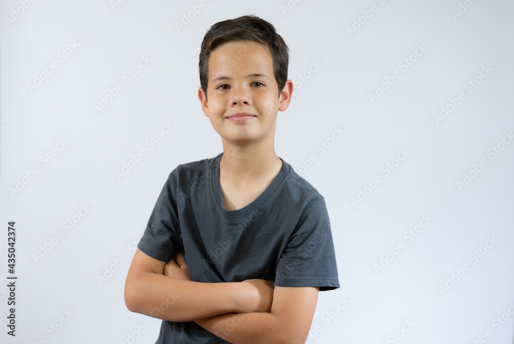 Young handsome boy standing on white studio background. Young handsome boy standing on white studio background.