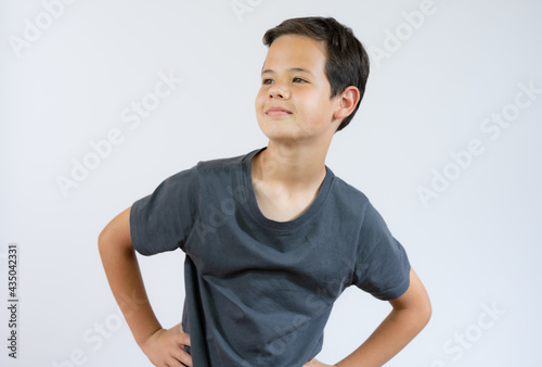 Beautiful young boy very cool and confident isolated over white background