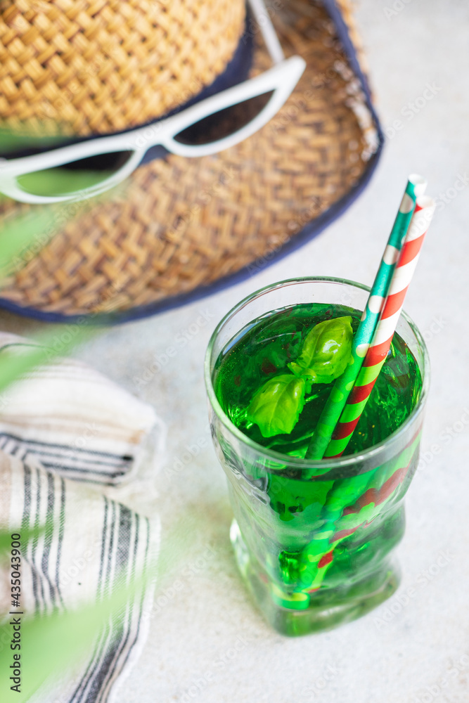 summer background tarragon lemonade tropical leaf palm green basil beverage ice drink refreshing straw hat, sunglasses accessories summer vacation relax positive mood vacation top view summer background tarragon lemonade tropical leaf palm green basil beverage ice drink refreshing straw hat, sunglasses accessories summer vacation relax positive mood vacation top view