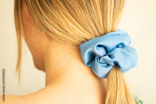 Closeup shot of a blonde female with a ponytail