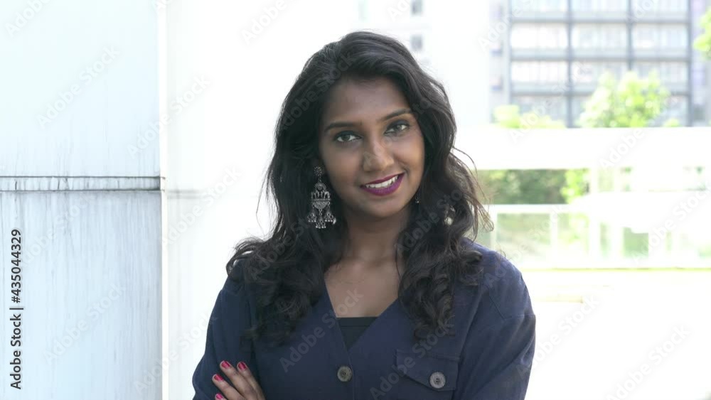 Portrait of a beautiful Asian Indian woman, smiling and looking at camera. Portrait of a beautiful Asian Indian woman, smiling and looking at camera.